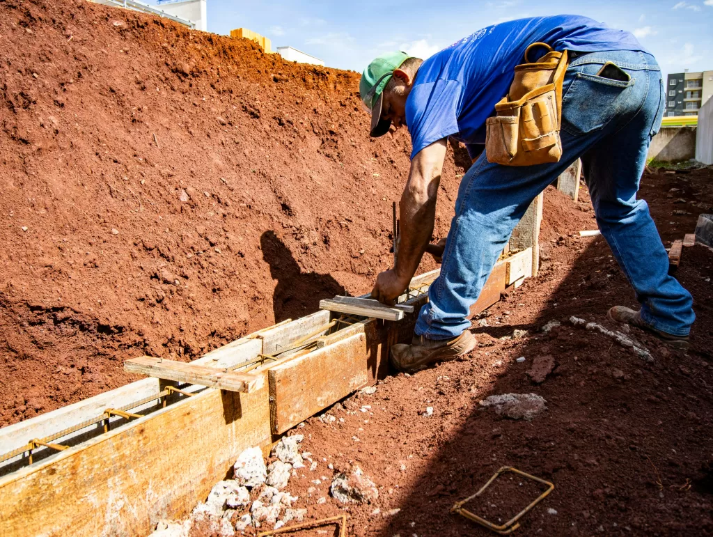 Contractor working outdoors with wood