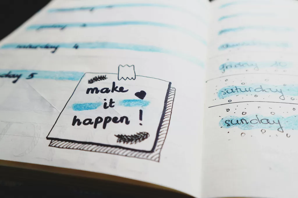 make it happen written in notebook