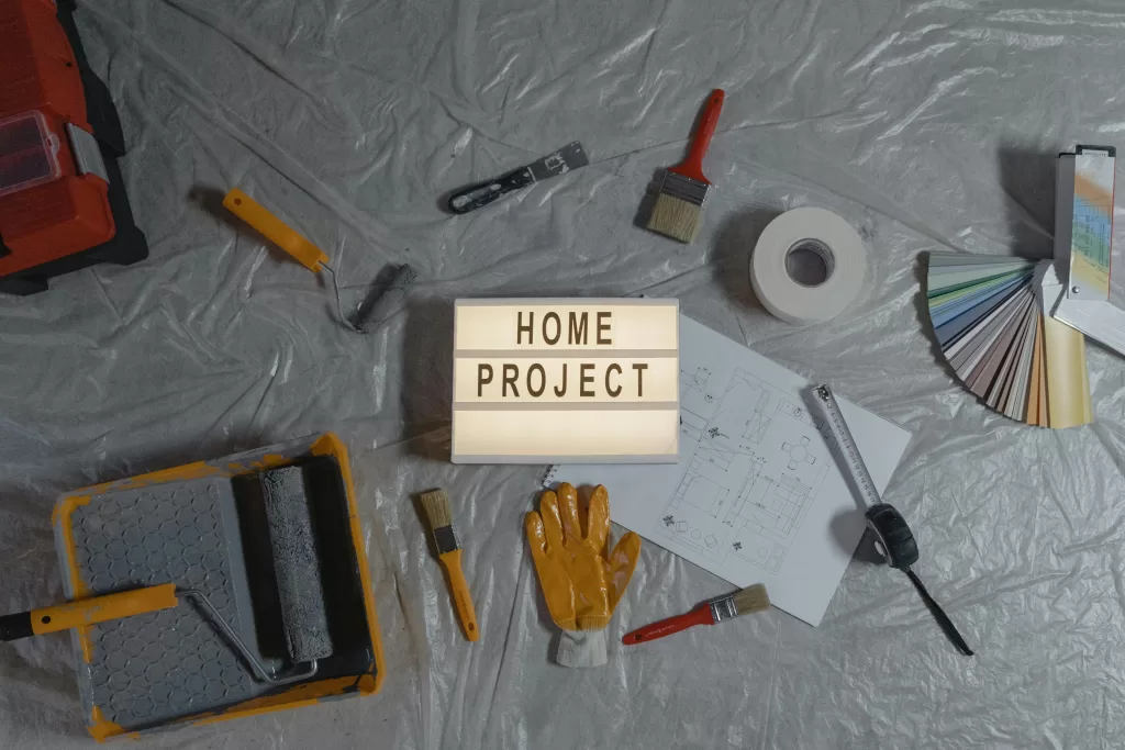 Home Project sign with tools on a tarp