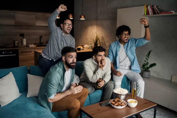 Friends watching sport on tv.