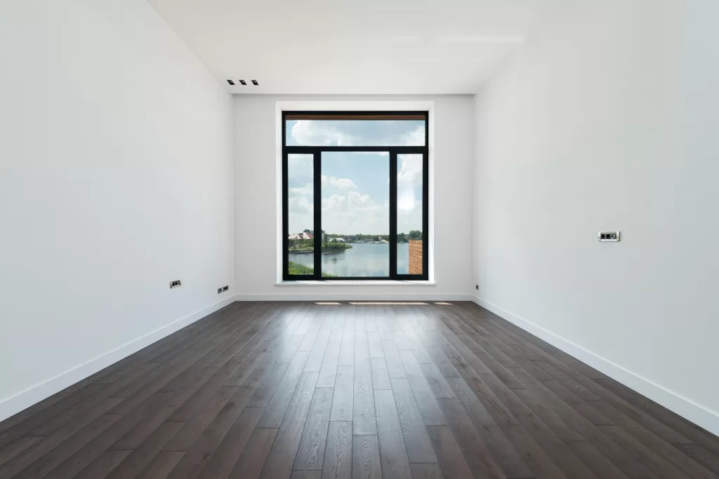 An empty room with wooden tiles