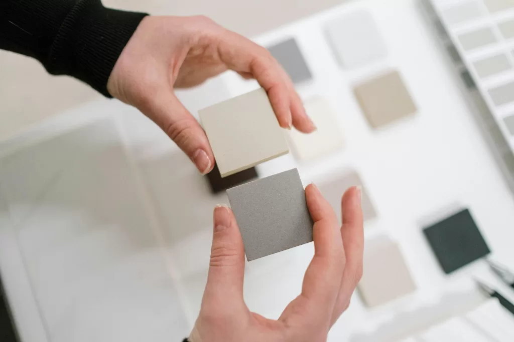 Person choosing between two paint color options