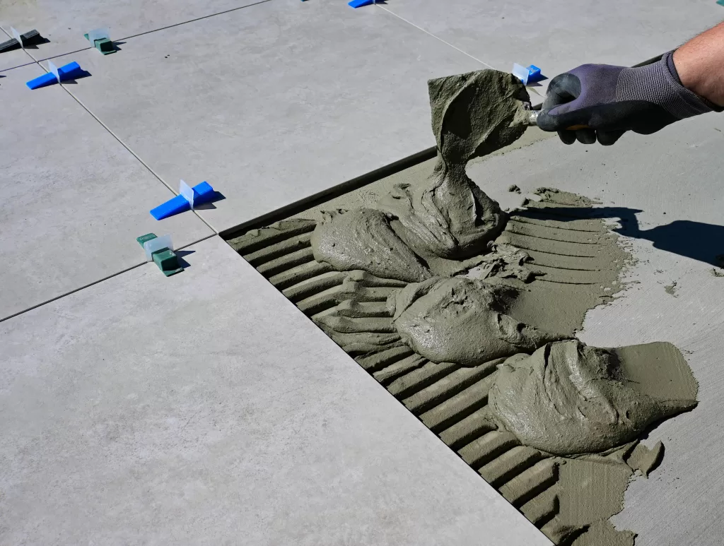 Person putting grout down on floor