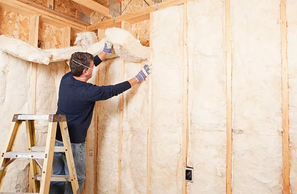 Man insulating his home