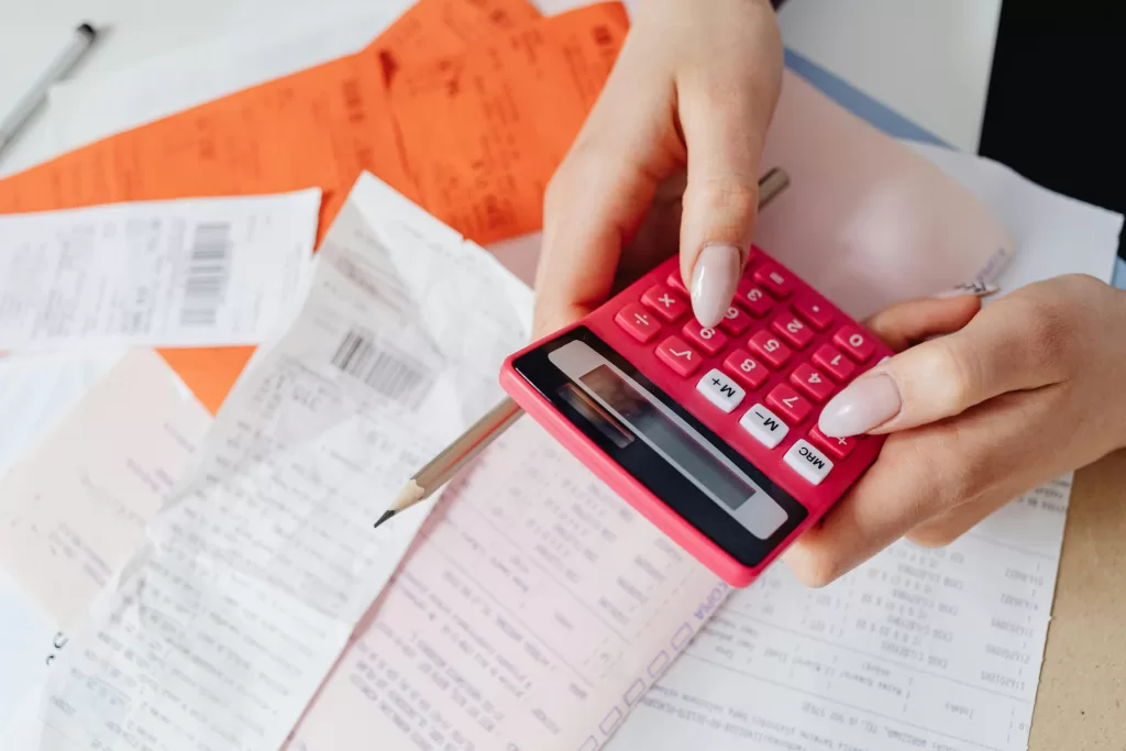 Woman using calculator