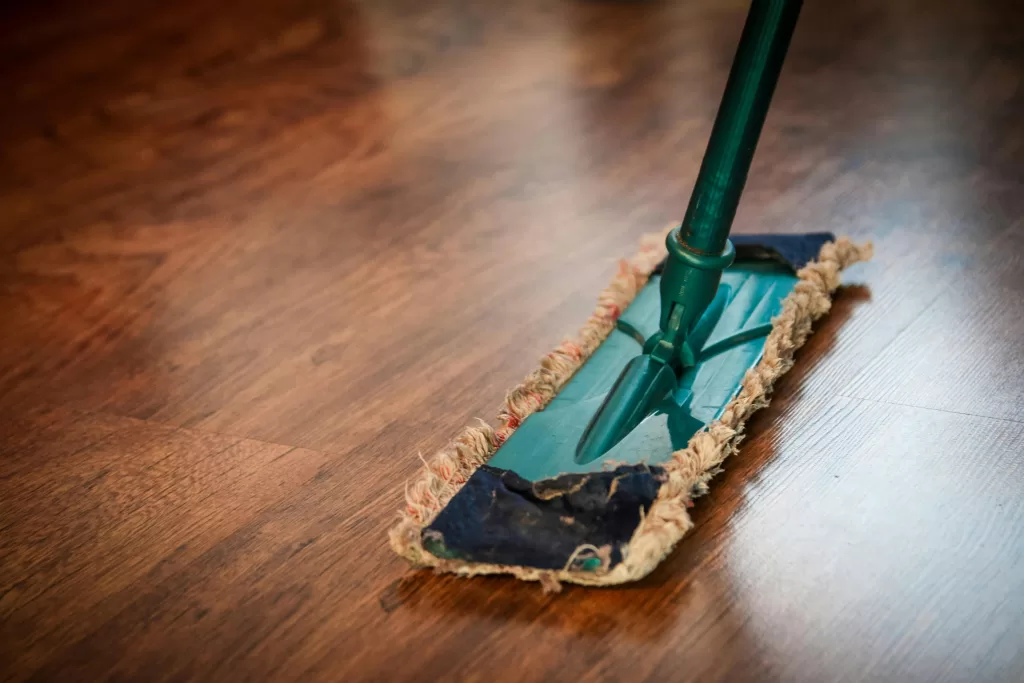 Hardwood floor being dry mopped