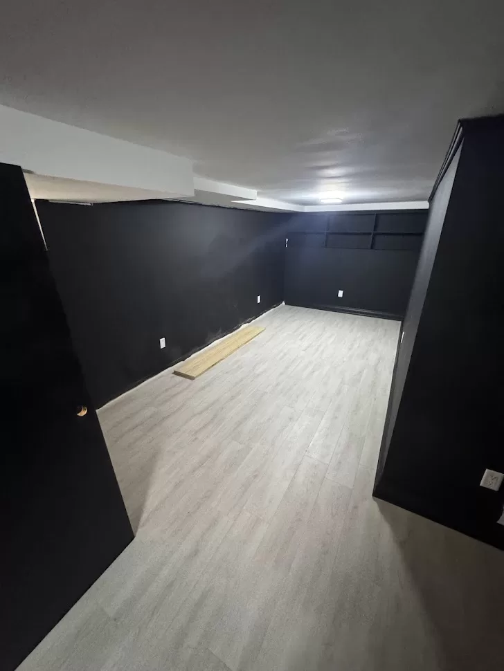 basement hallway after flooring and painting