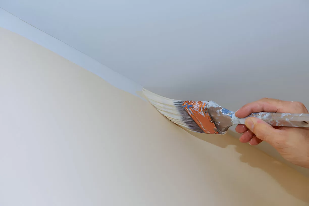 Clean ceiling cut‑line using an angled brush in a Toronto interior repaint.