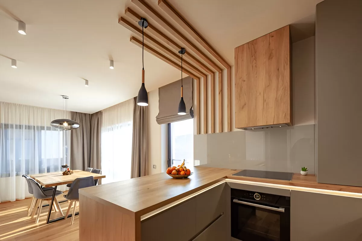 Toronto kitchen renovation with L‑shape and slim peninsula for seating.