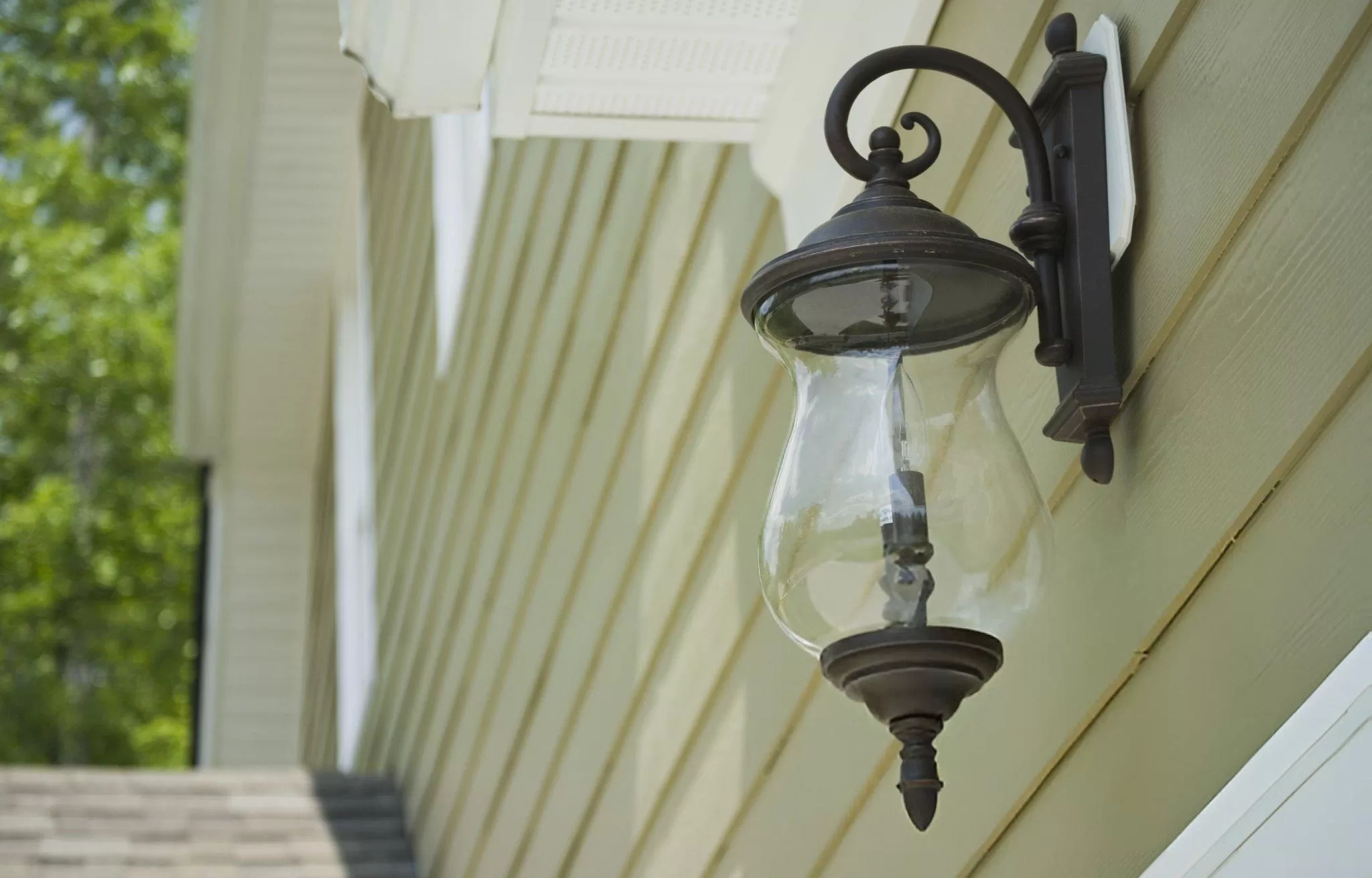 Wall light on siding in Toronto.
