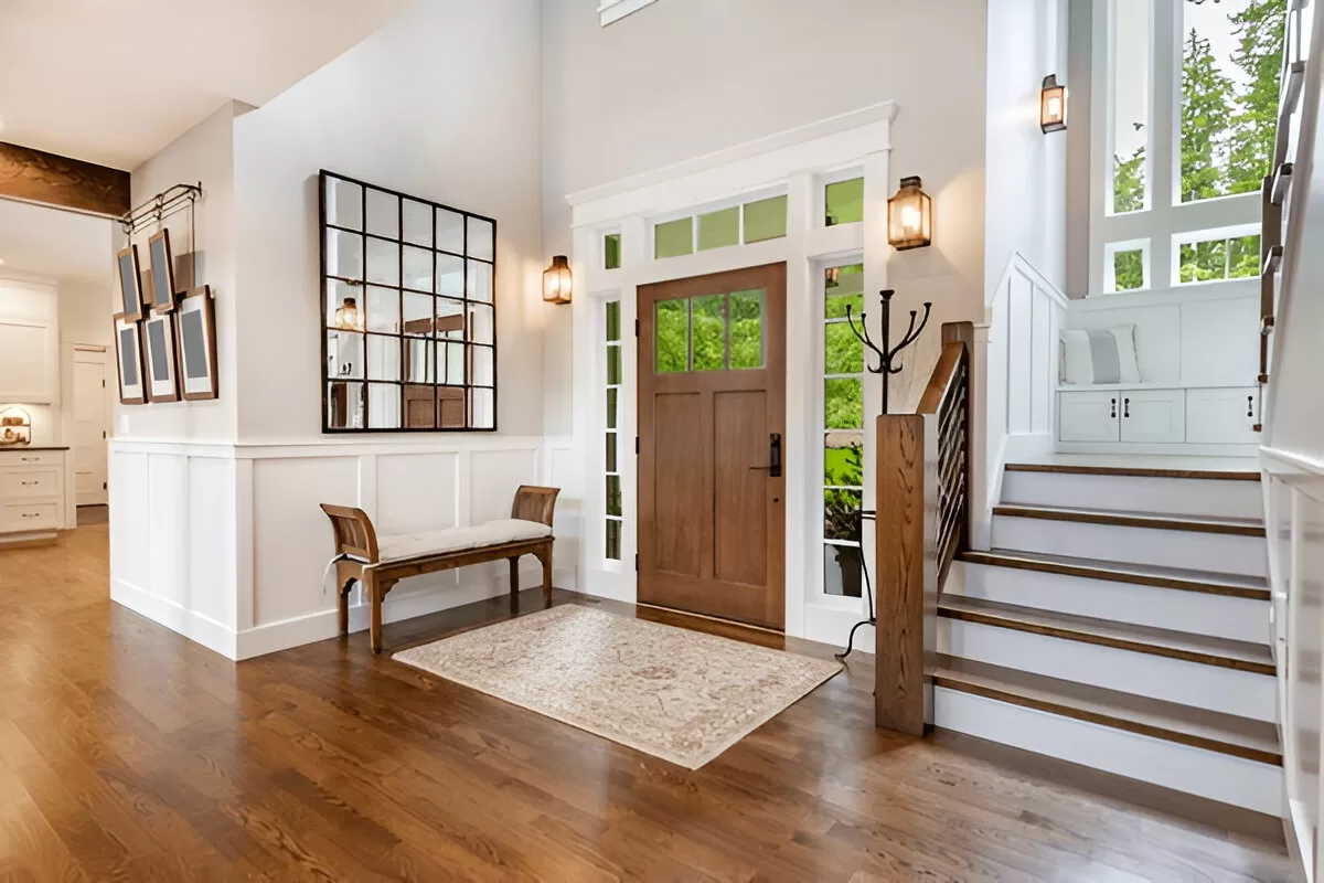 Bright Toronto entry with a bench and hooks.