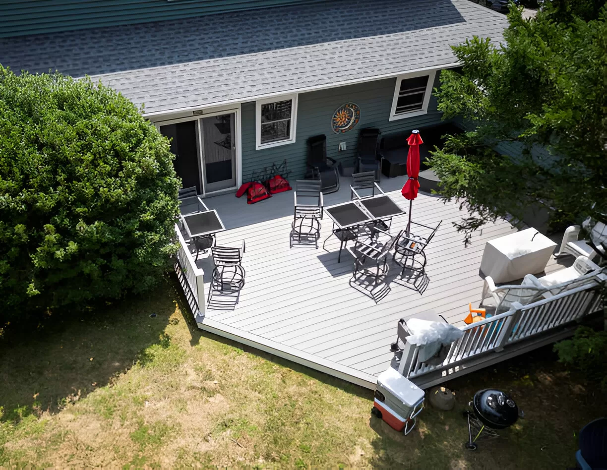 Composite deck with aluminum railing and planters in a Toronto backyard.