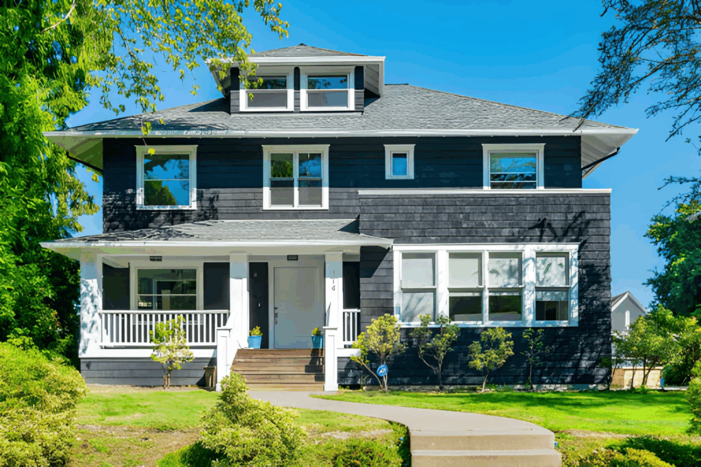 Front elevation of a home with a new second storey and aligned windows.