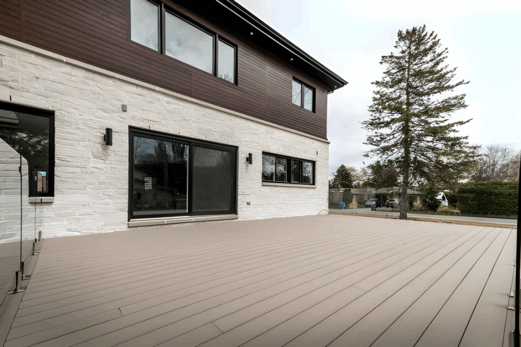 Modern composite deck in a Toronto backyard with clean lines and snow‑resistant details.