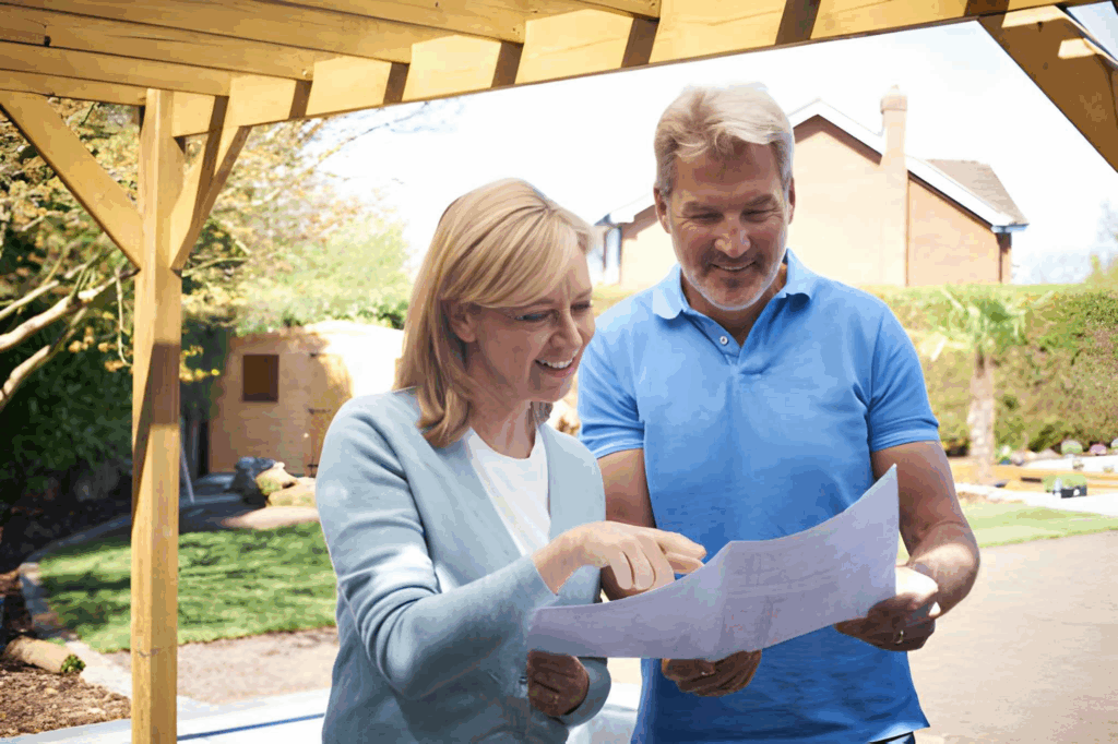 Neighbours discussing shared boundary fence plans in Toronto.
