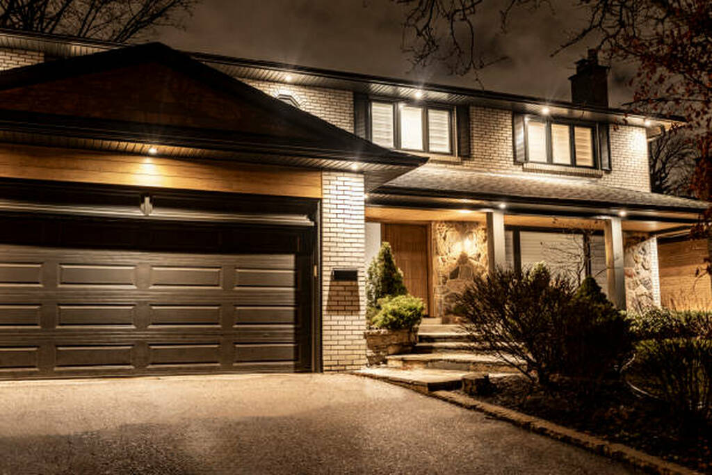 after of Toronto front porch renovation with updated exterior lighting.