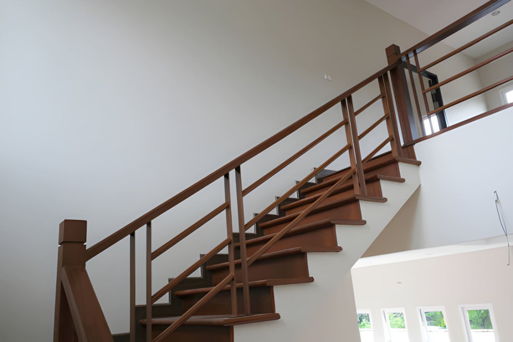Renovation Services image 3 - modern stained staircase and painted wall