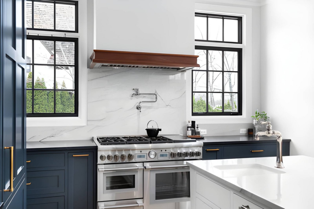 modern remodeled kitchen, blue cabinets, marble backsplash