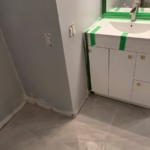 Windermere Avenue bathroom renovation process,   partially complete sink, flooring & painted wall