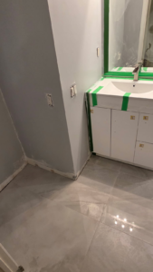 Windermere Avenue bathroom renovation process,   partially complete sink, flooring & painted wall