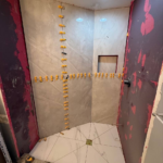 Windermere Avenue bathroom renovation process, partially tiled shower