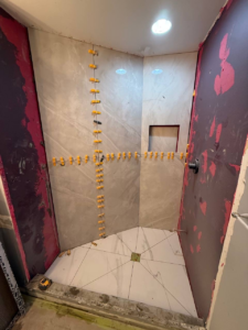 Windermere Avenue bathroom renovation process, partially tiled shower