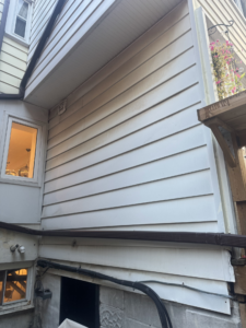Roselawn Ave Mudroom & Powder Room Additions siding before