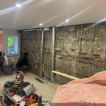 Roselawn Ave process. living room wall stripped