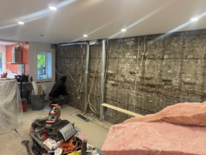Roselawn Ave process. living room wall stripped
