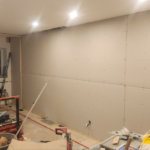 Roselawn Ave process. living room wall, drywall placed