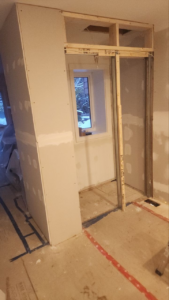 Roselawn Ave process. living room corner primed & framed